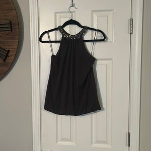 Dark gray sheet top with jewels around neck and elastic waist.